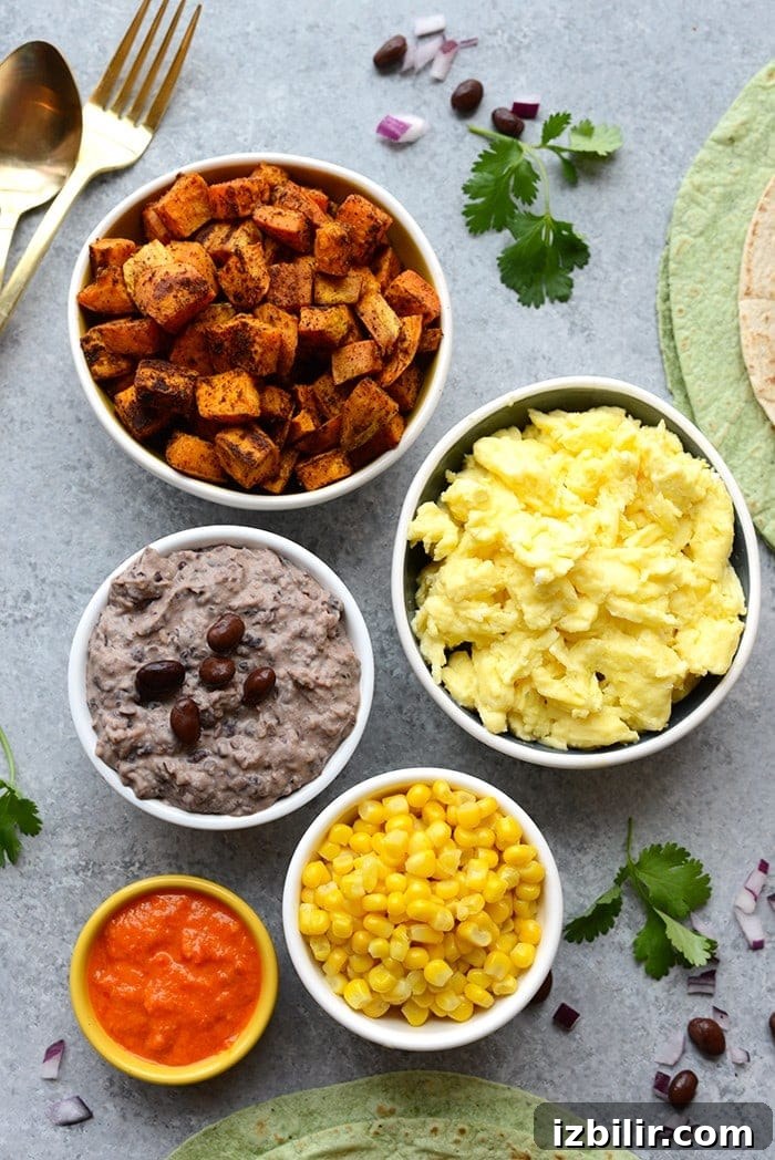 Get your meal prep on and make these Vegetarian Black Bean Breakfast Burritos! They're packed with 16g protein per serving AND they're freezer friendly!
