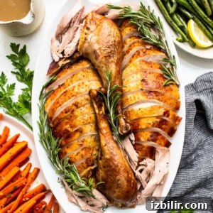 Rich Homemade Turkey Stock for Soups and Gravies 6 Turkey sliced and on a platter.