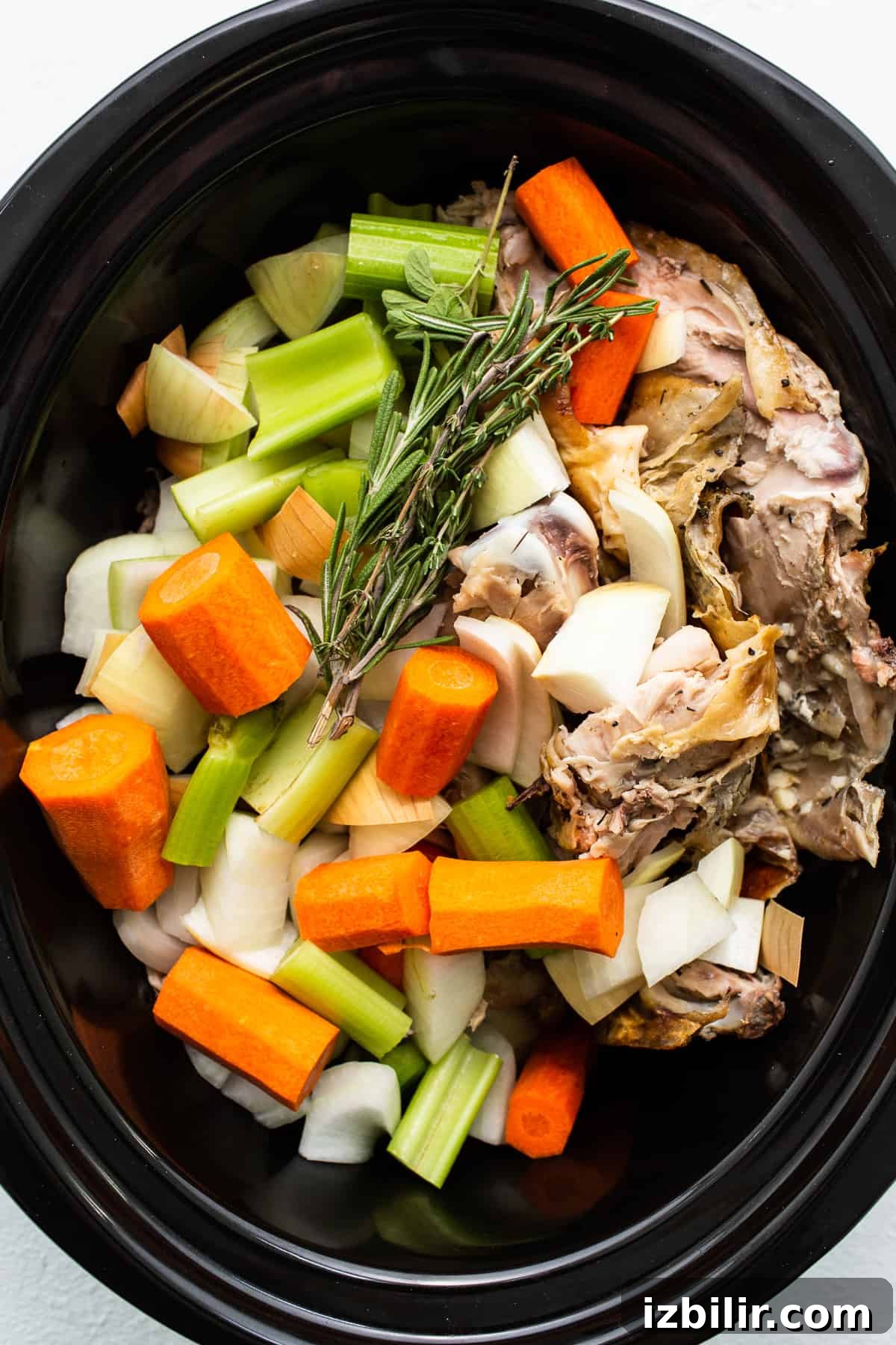 Rich Homemade Turkey Stock for Soups and Gravies 4 Turkey stock ingredients in a slow cooker.