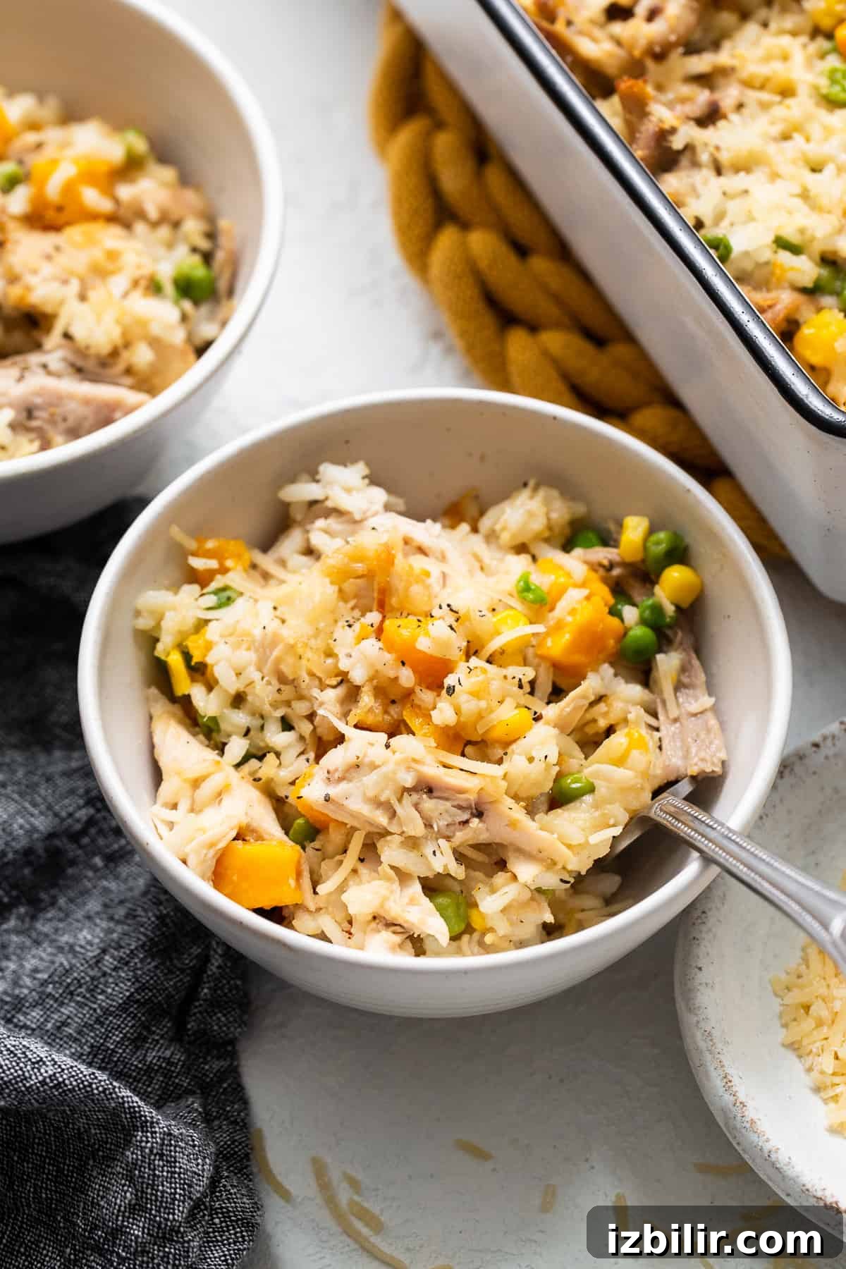 Turkey casserole in a bowl with a spoon.