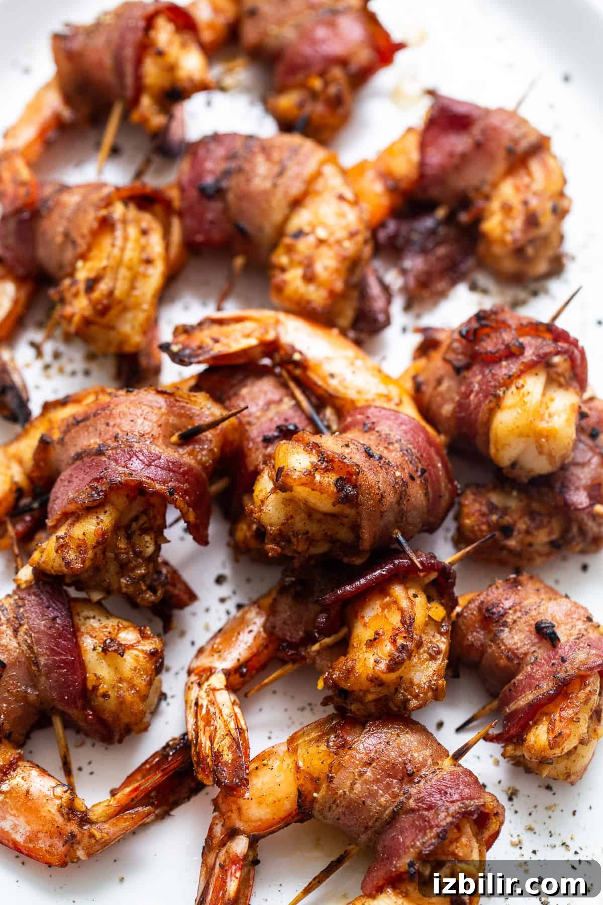 Bacon wrapped shrimp on a serving platter.