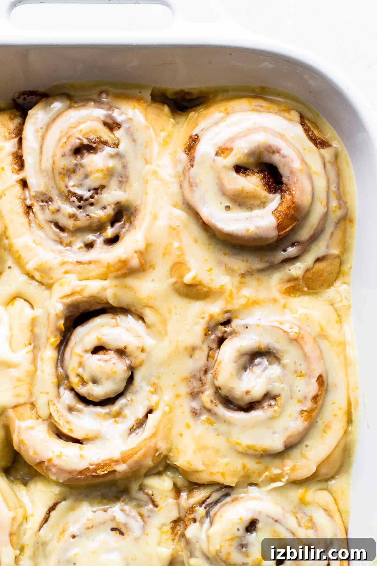 Orange-Glazed Sweet Rolls Recipe 2 Sweet orange roll in a pan.