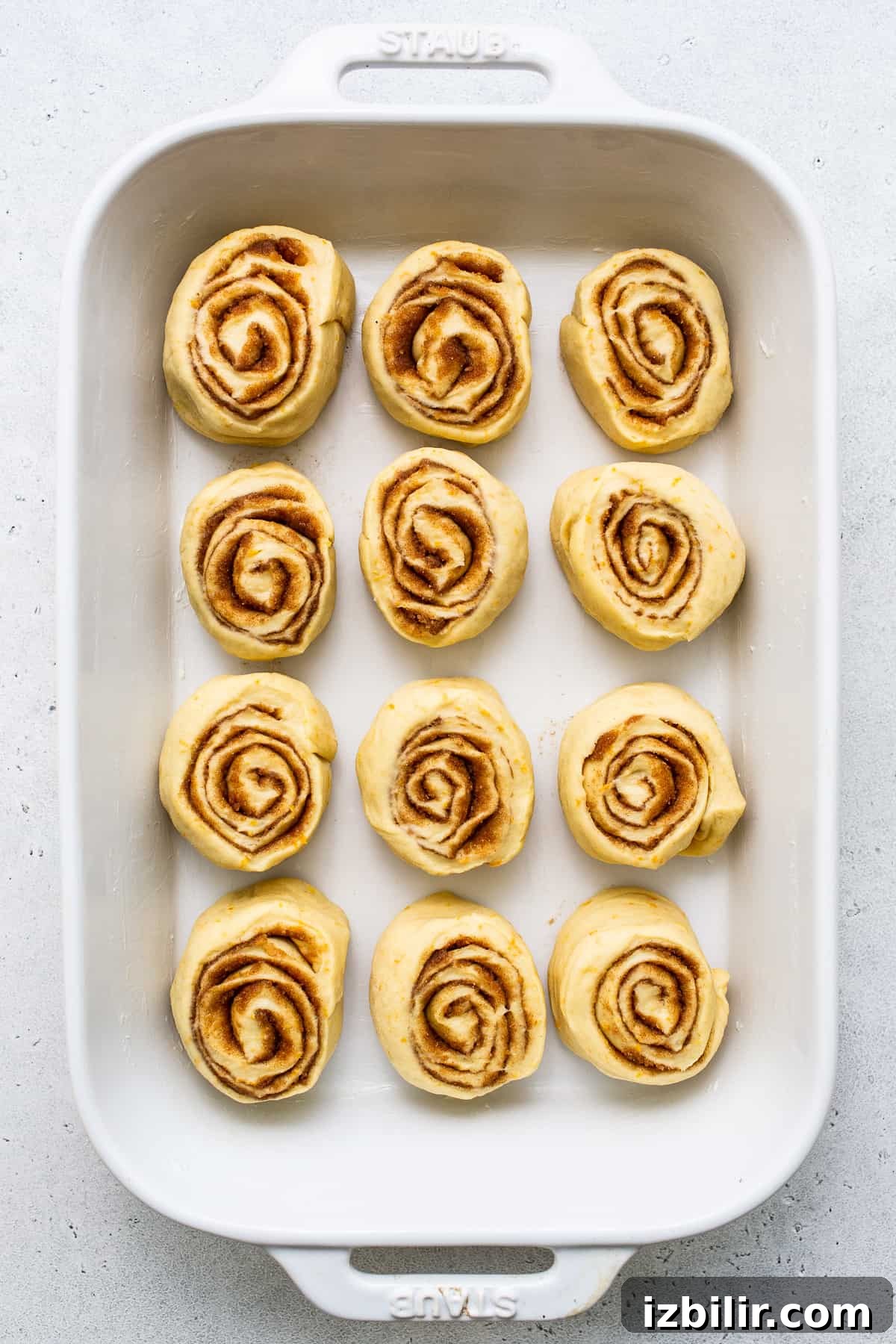 Orange-Glazed Sweet Rolls Recipe 4 Rolls in a pan.