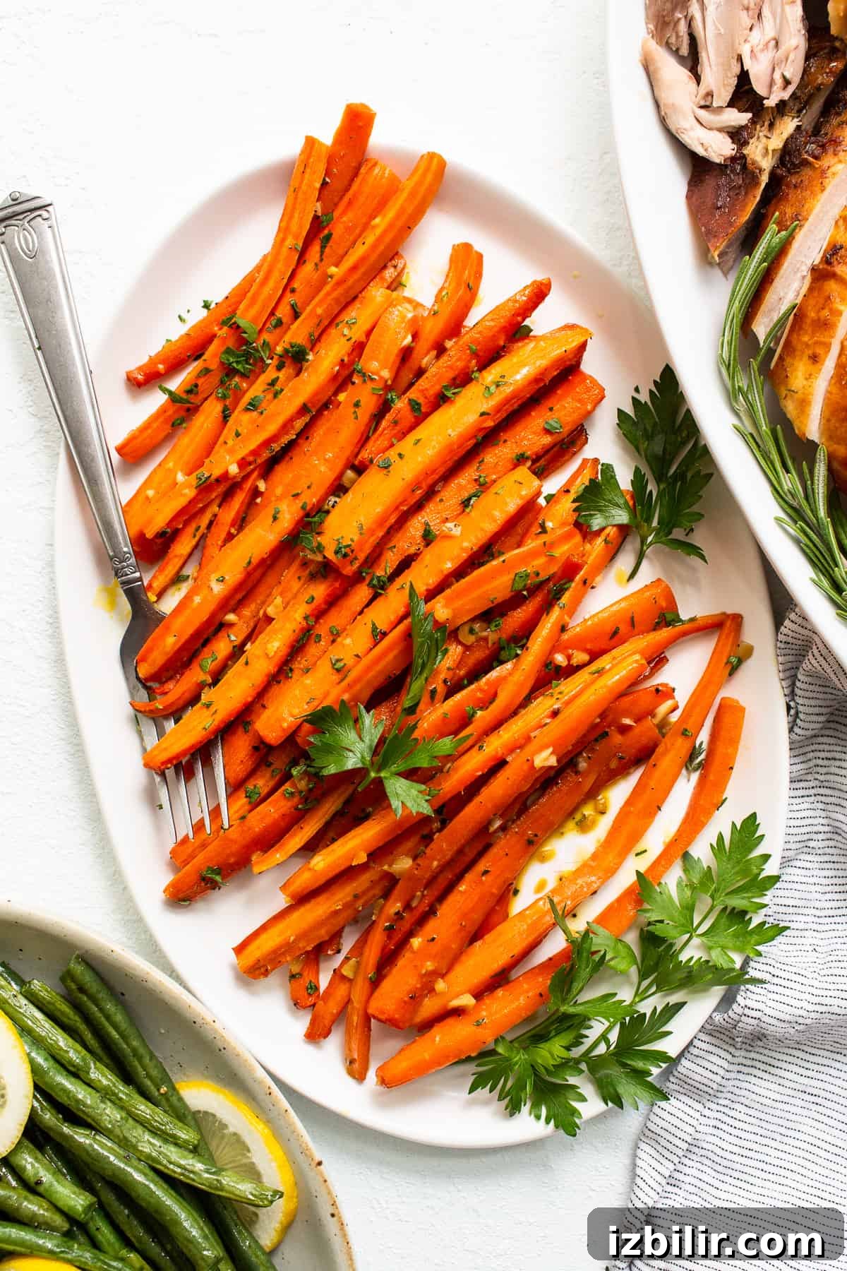 Garlic glazed carrots on a plate.