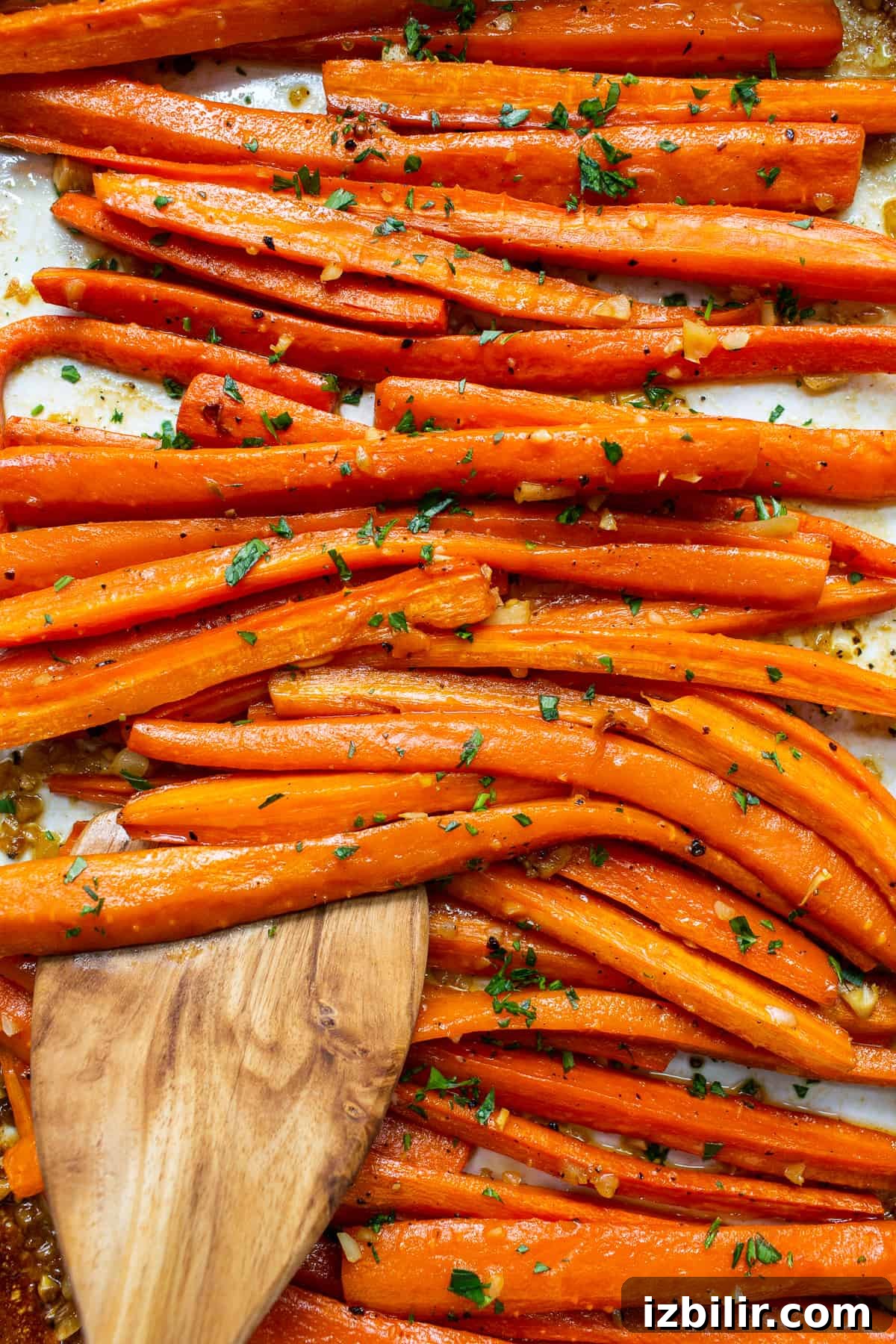 Garlic glazed carrots topped with parsley.