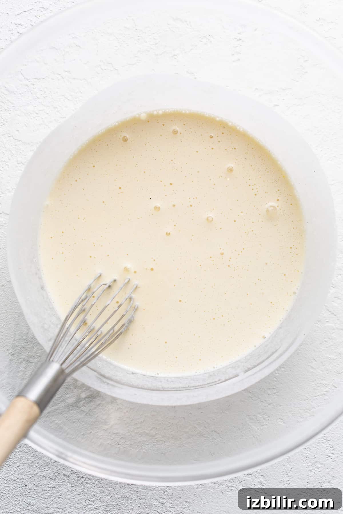 Creamy Eggnog Creme Brulee Recipe 4 Melted ice cream in a bowl.