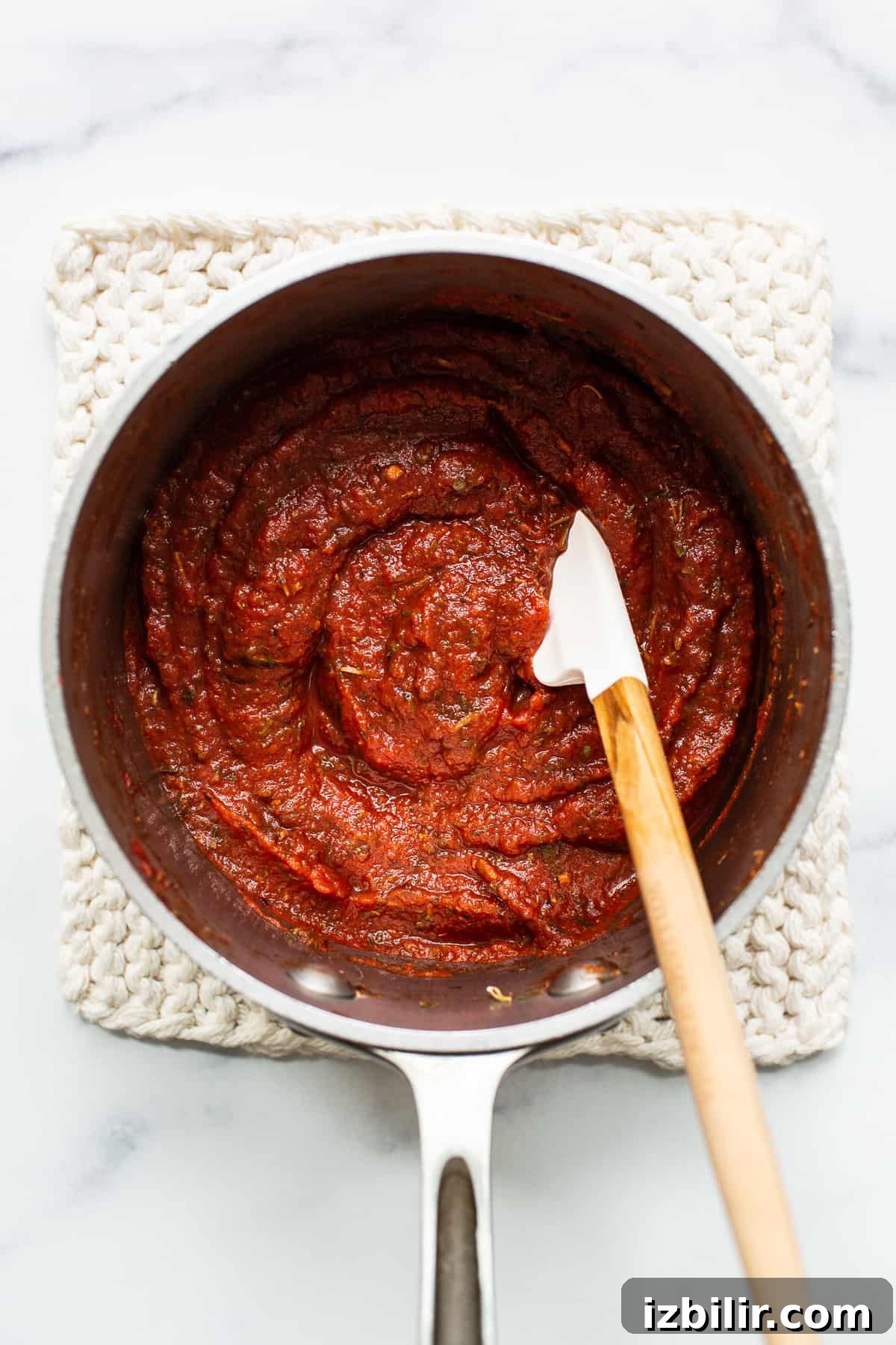 Homemade pizza sauce in a sauce pan.