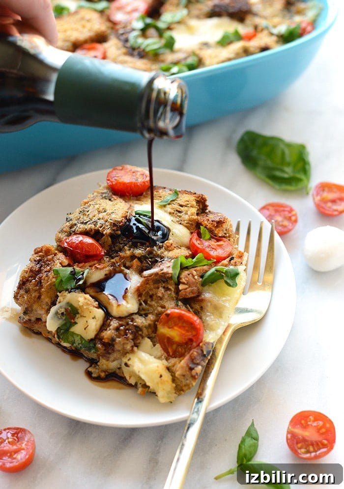 15+ Egg Breakfast Recipes to Elevate Your Morning 12 A person is pouring a sauce on a plate of bread for their Caprese Egg Bake.