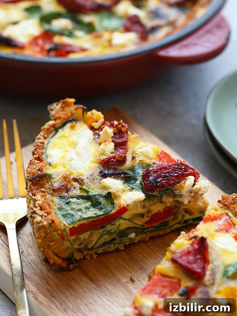 15+ Egg Breakfast Recipes to Elevate Your Morning 13 a slice of quiche on a cutting board with a fork.