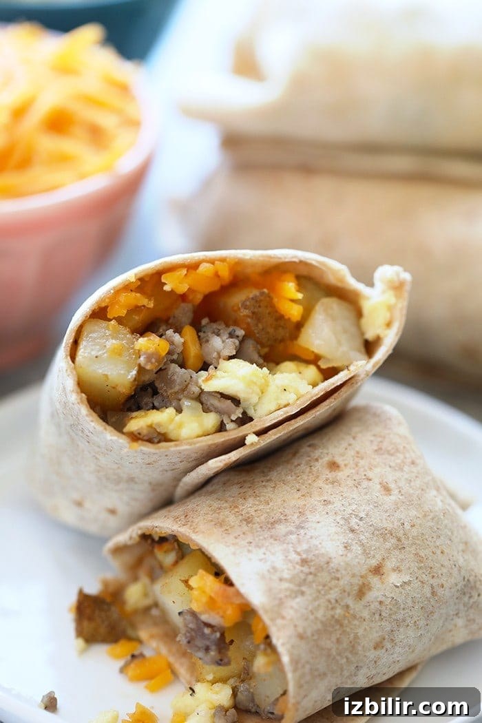 15+ Egg Breakfast Recipes to Elevate Your Morning 18 Breakfast burritos on a plate with cheese and eggs.