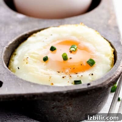 15+ Egg Breakfast Recipes to Elevate Your Morning 3 A fried egg cooked in a cast iron pan.