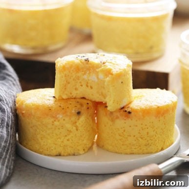 15+ Egg Breakfast Recipes to Elevate Your Morning 4 a plate with a stack of mini corn muffins and a fork.