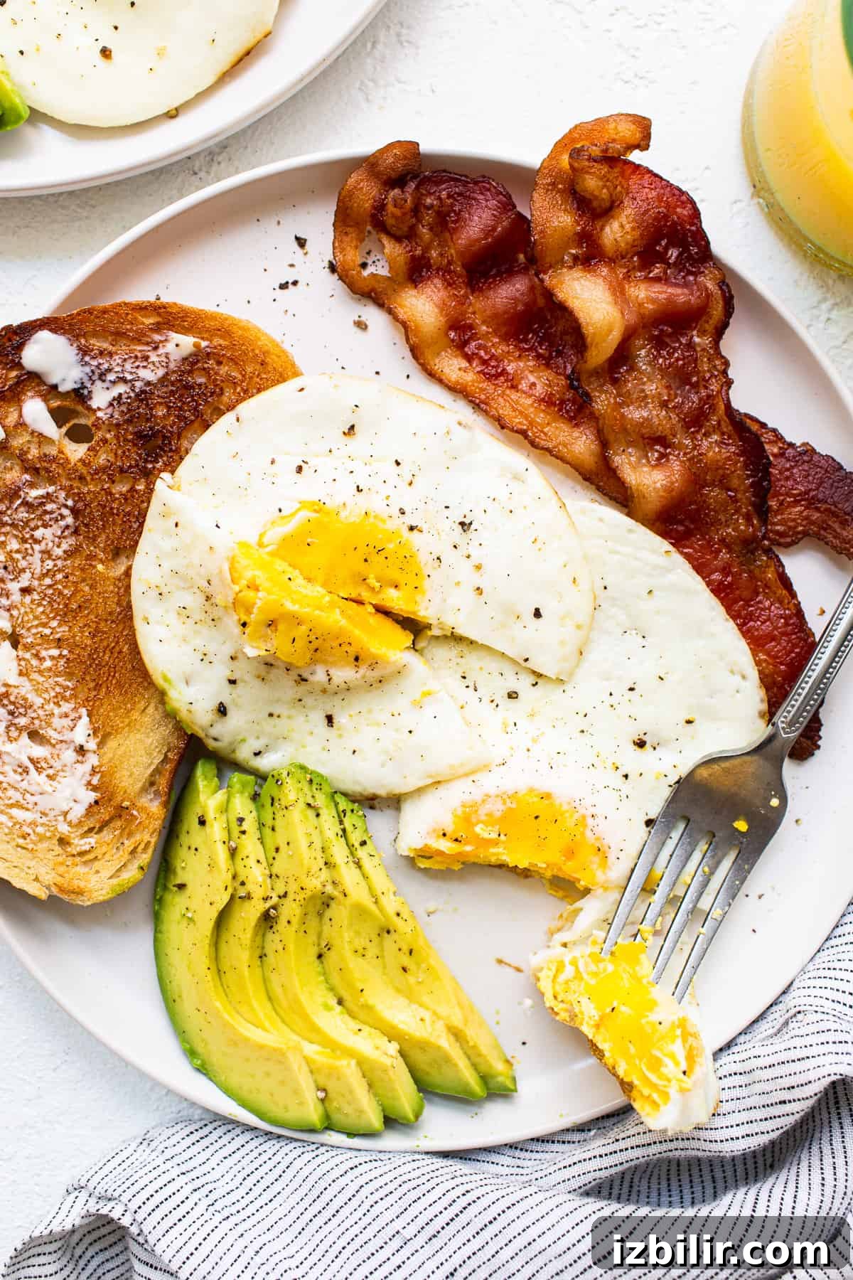 Over hard eggs on a plate.