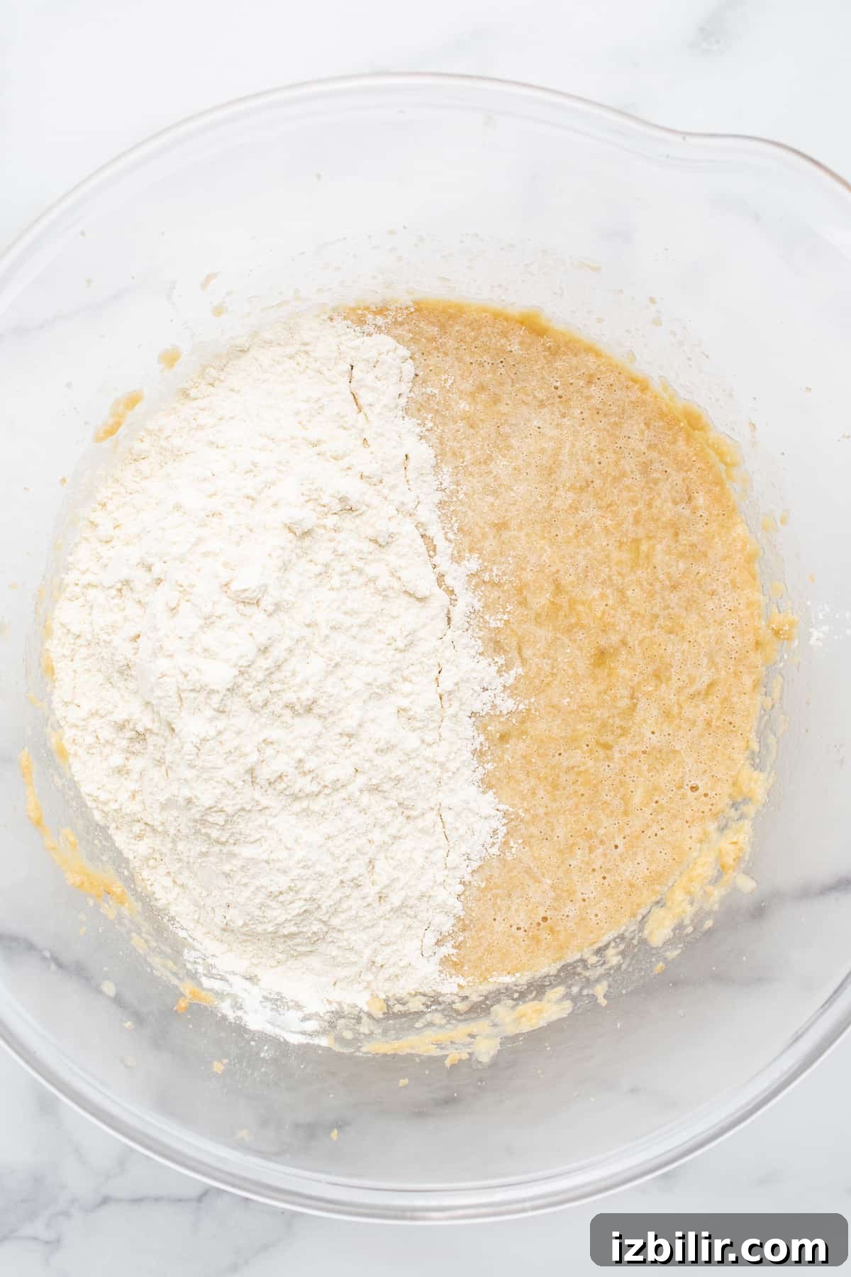 Batter for banana bread muffins in a bowl.