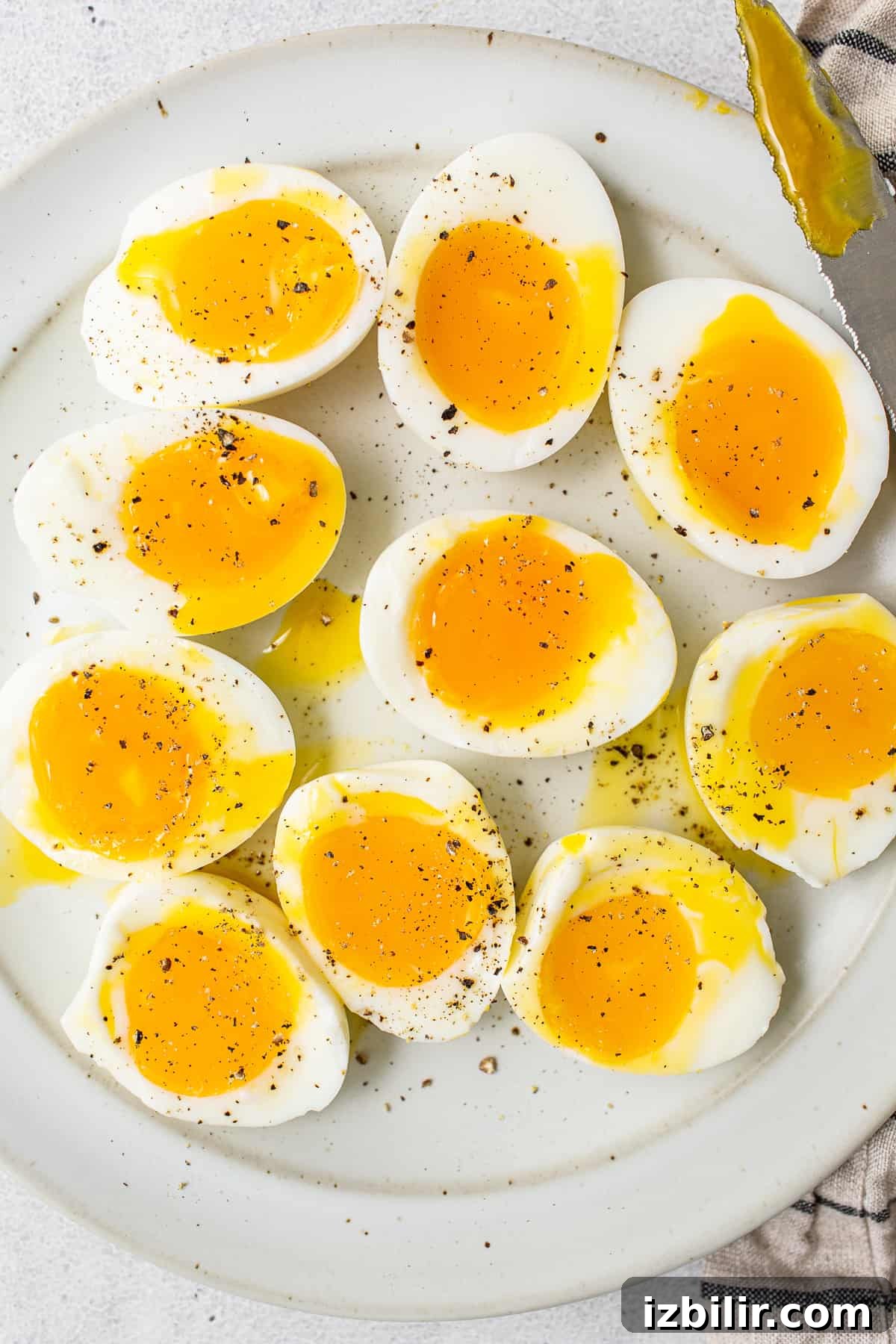 Soft boiled eggs on a plate.