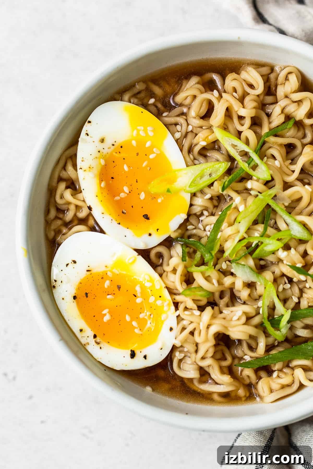 Soft boiled eggs in a bowl of ramen.
