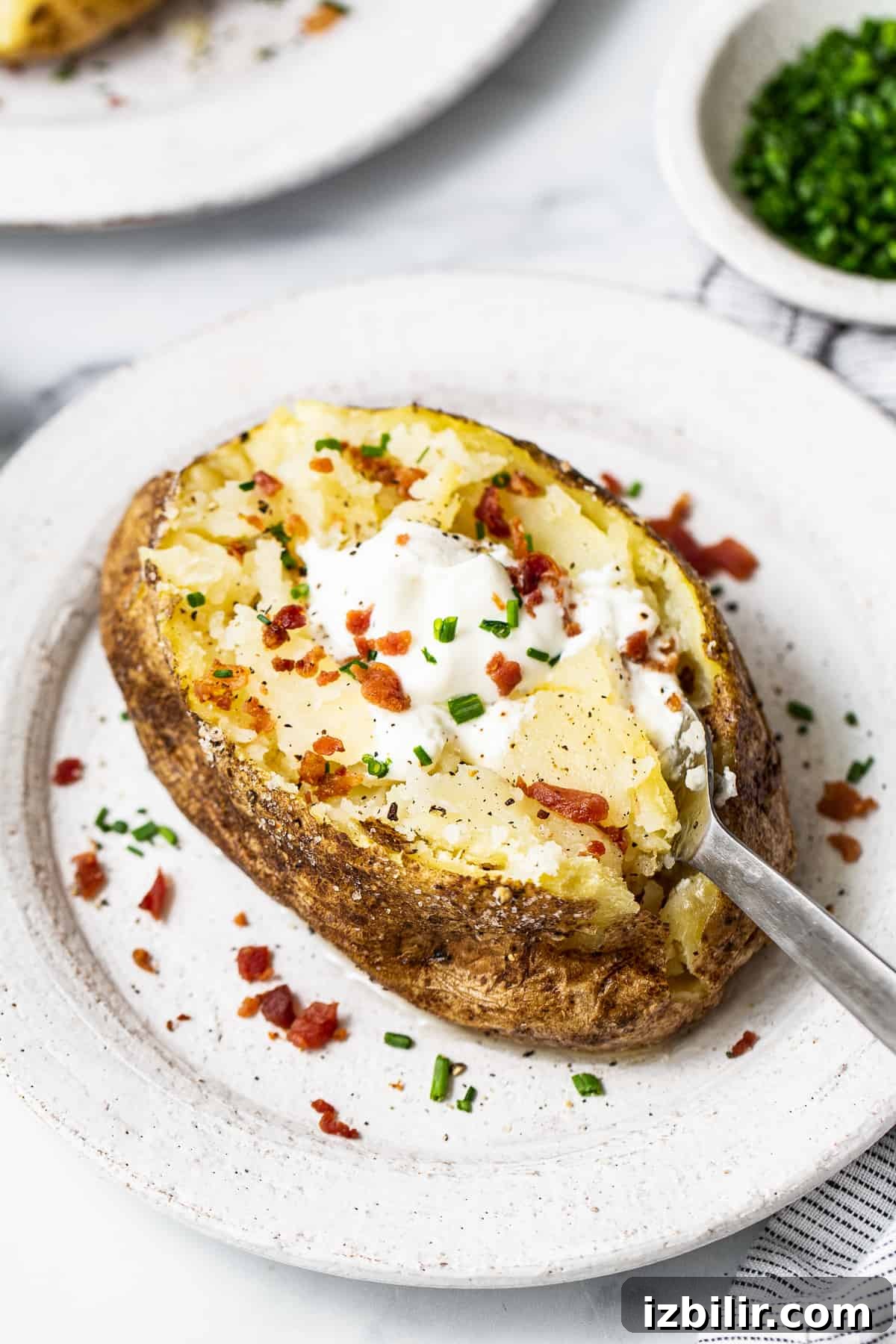 How to Make a Microwave Baked Potato 4 Microwave potato topped with toppings.
