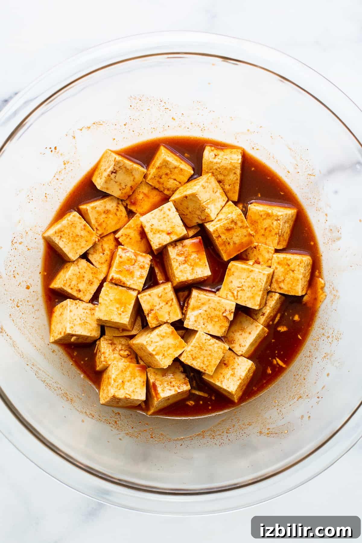 Tofu marinating in gochujang sauce.