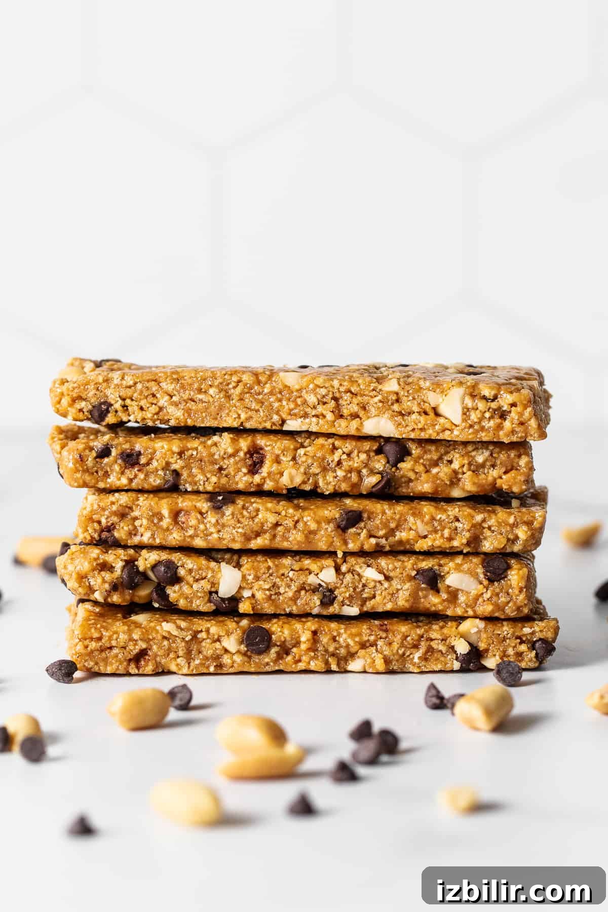 No-bake peanut butter bars stacked on a plate. No bake peanut butter bars stacked on a plate.