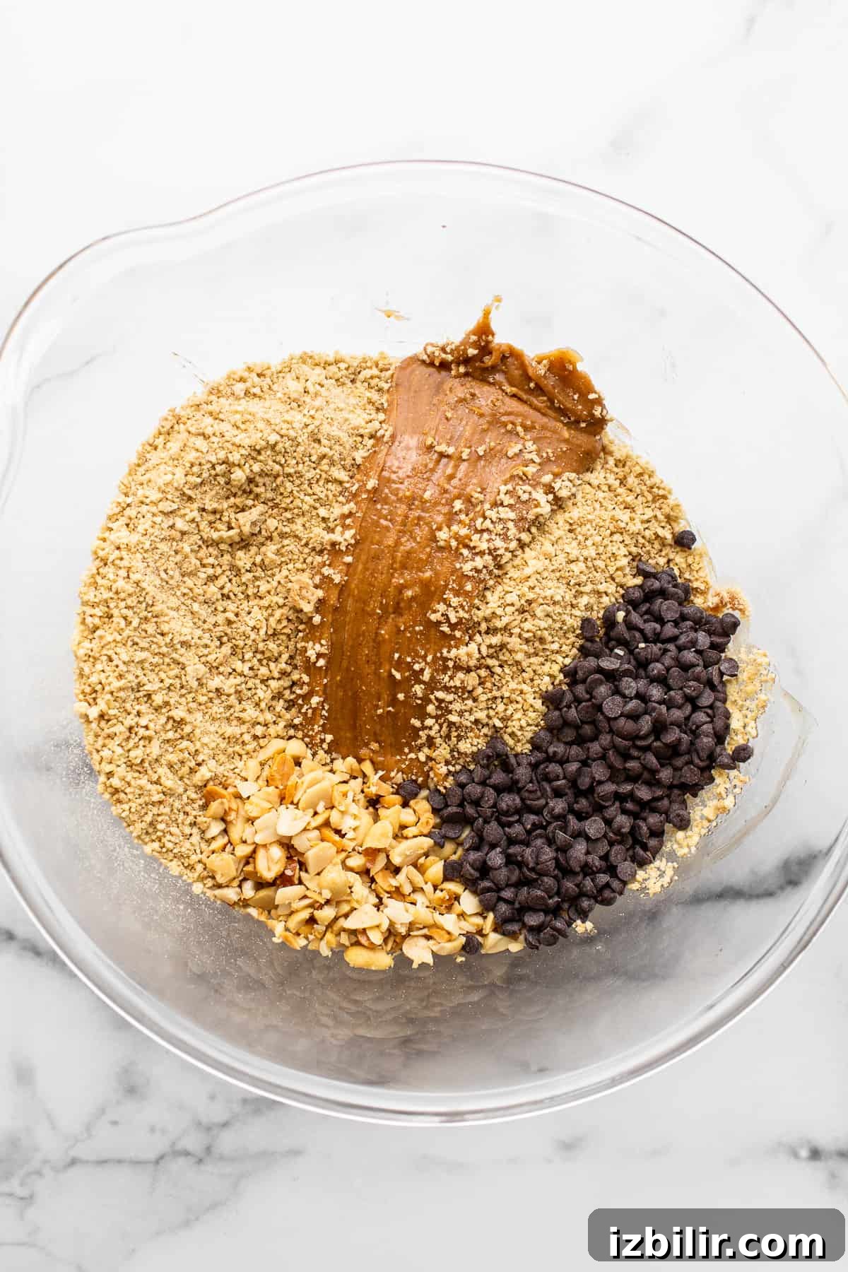 Ingredients for no-bake peanut butter bars in a bowl. Ingredients for no-bake peanut butter bars in a bowl.