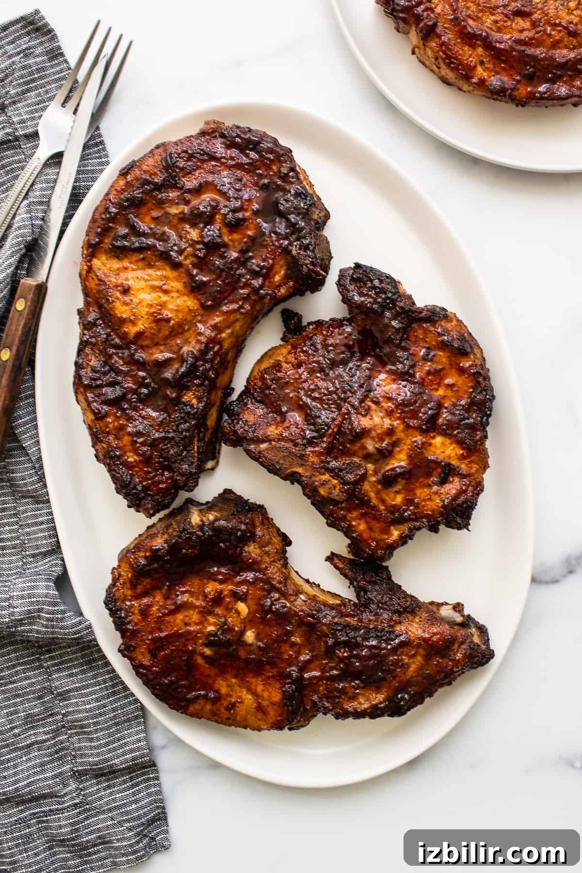 Air fryer pork chops on a plate.