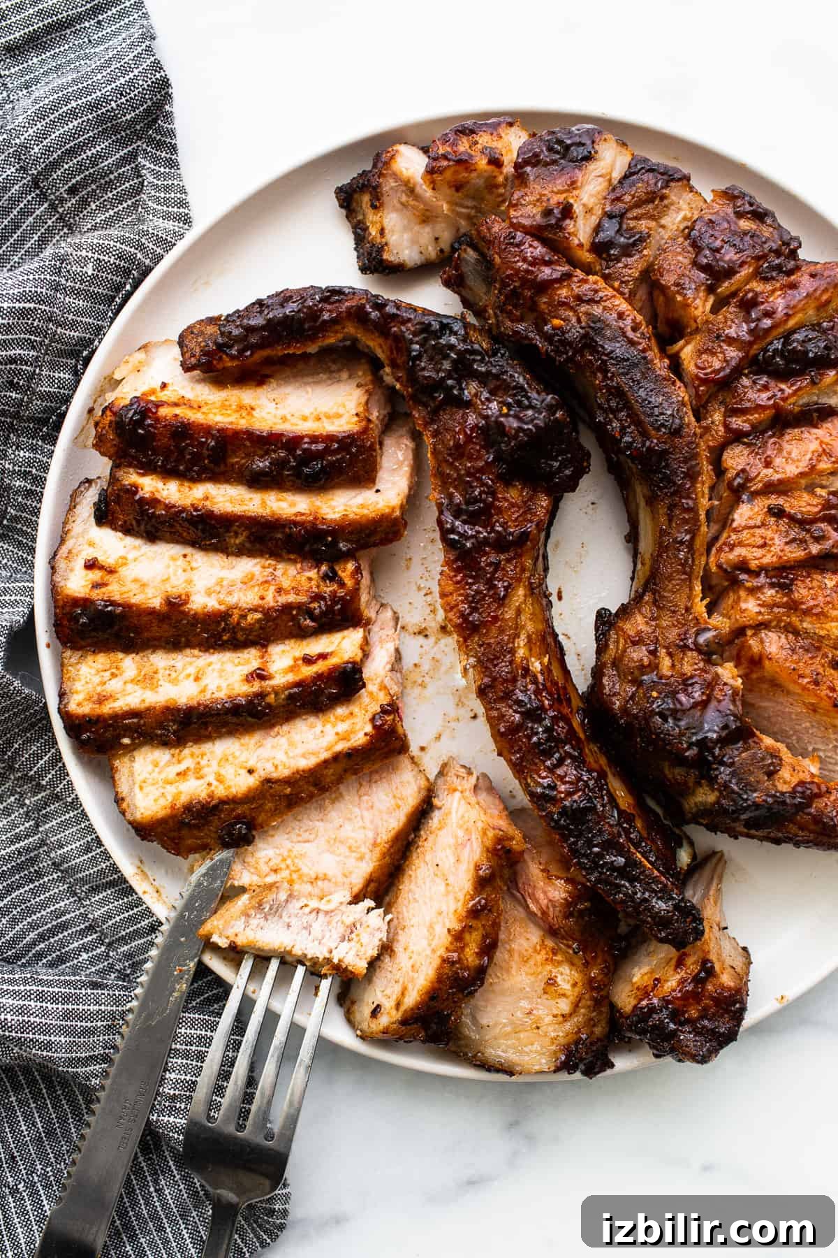 Sliced pork chops on a plate.