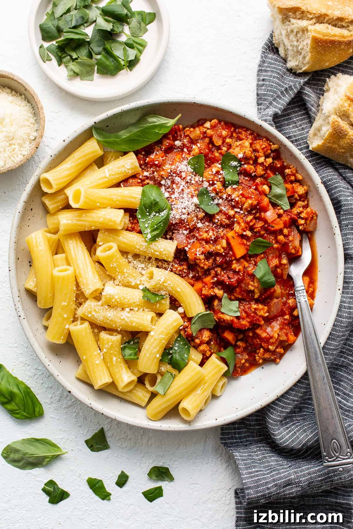 Ground chicken bolognese served with pasta Ground chicken bolognese in a bowl with pasta.
