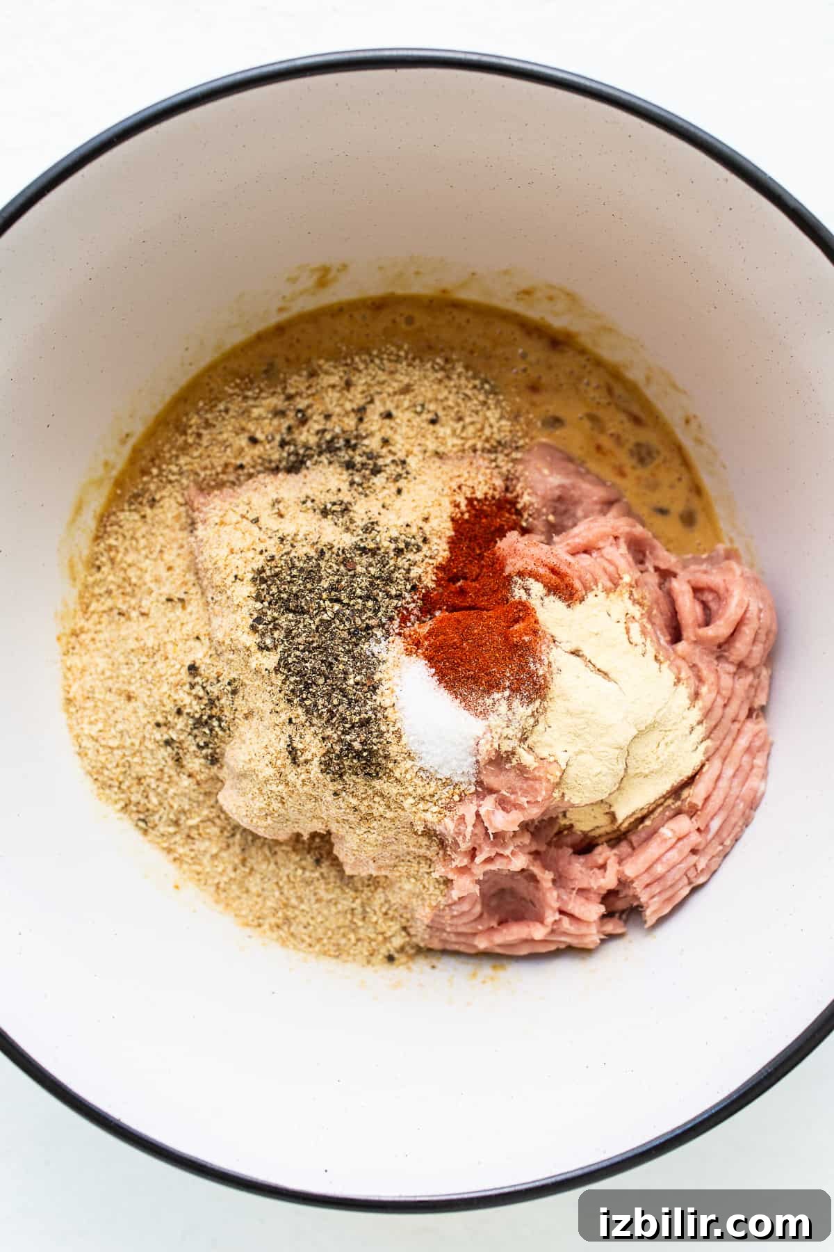 Ingredients for ground turkey meatloaf in a bowl.