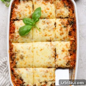 Spinach and Quinoa Lasagna Casserole Recipe 8 Full dish of spinach quinoa lasagna casserole cut into portions with fresh basil