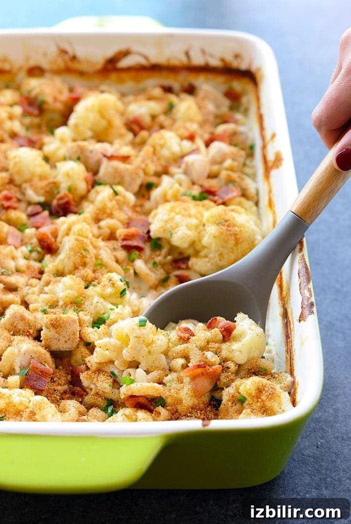 spoon of cauliflower chicken mac and cheese