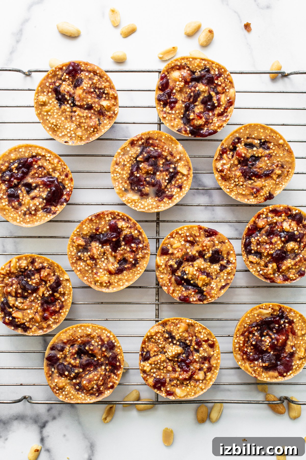 Peanut Butter and Jelly Quinoa Cups Recipe 5 Peanut butter and jelly cups on a wire rack.