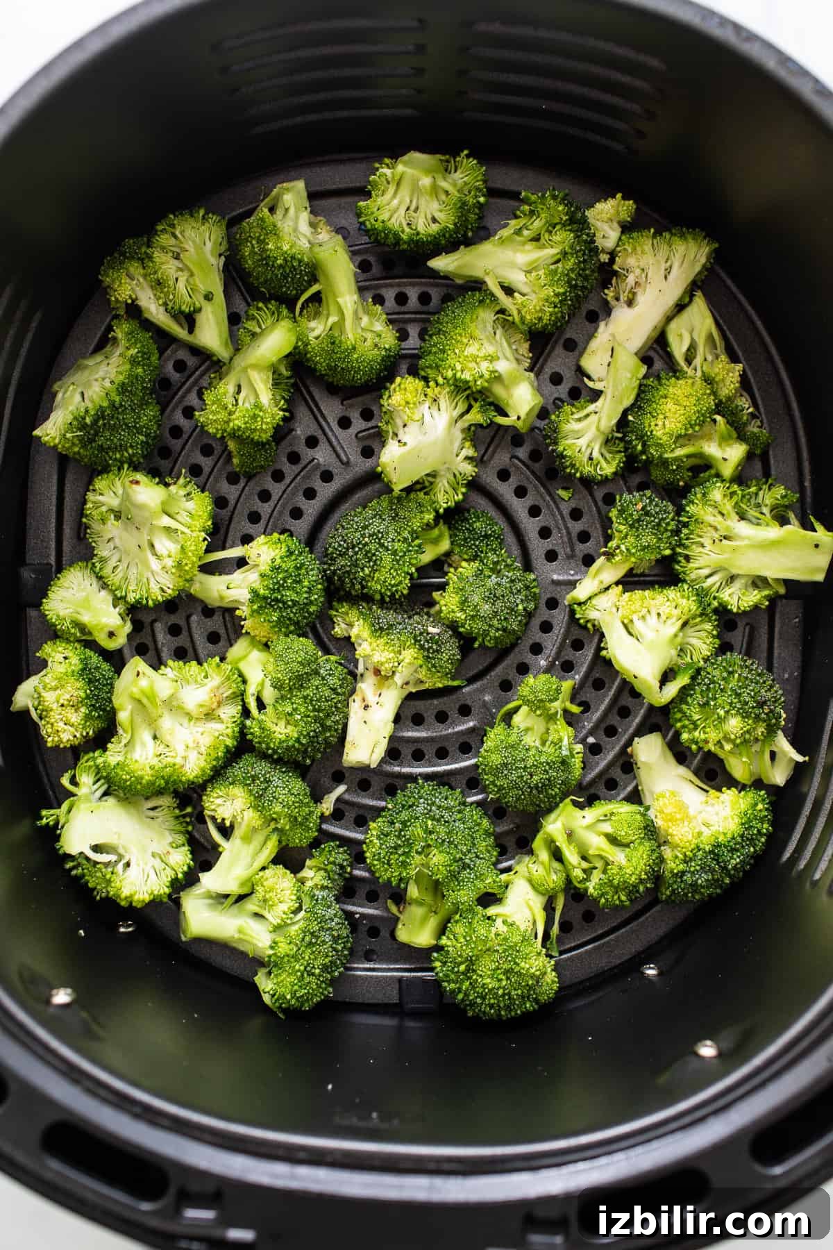 Broccoli florets in the air fryer.