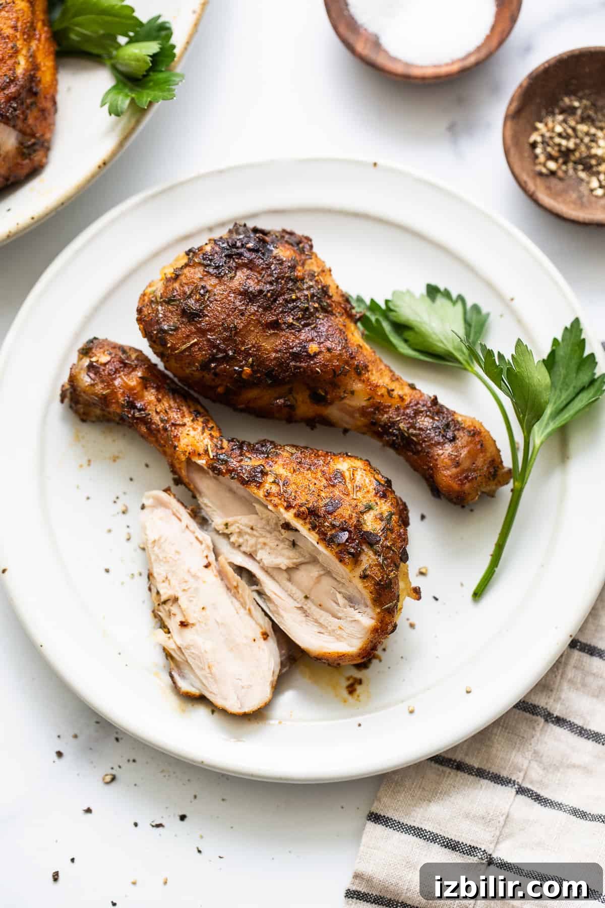 Baked chicken legs ready to serve. Baked chicken legs on a plate.