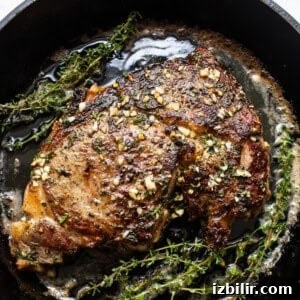 How to Make Restaurant-Style Cast Iron Steak at Home 8 Cast iron steak in a pan.