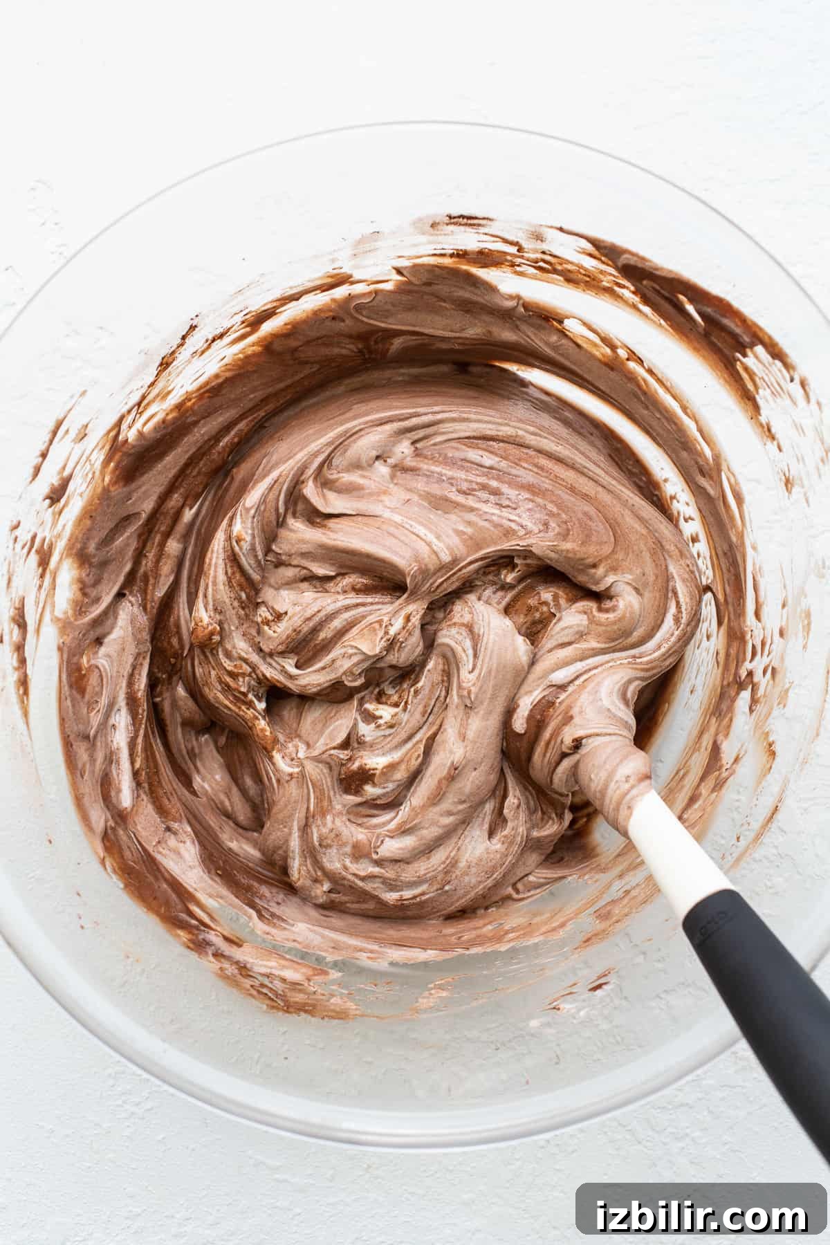 Mixing the Yogurt Base Frozen yogurt bark ingredients mixed together in a bowl.