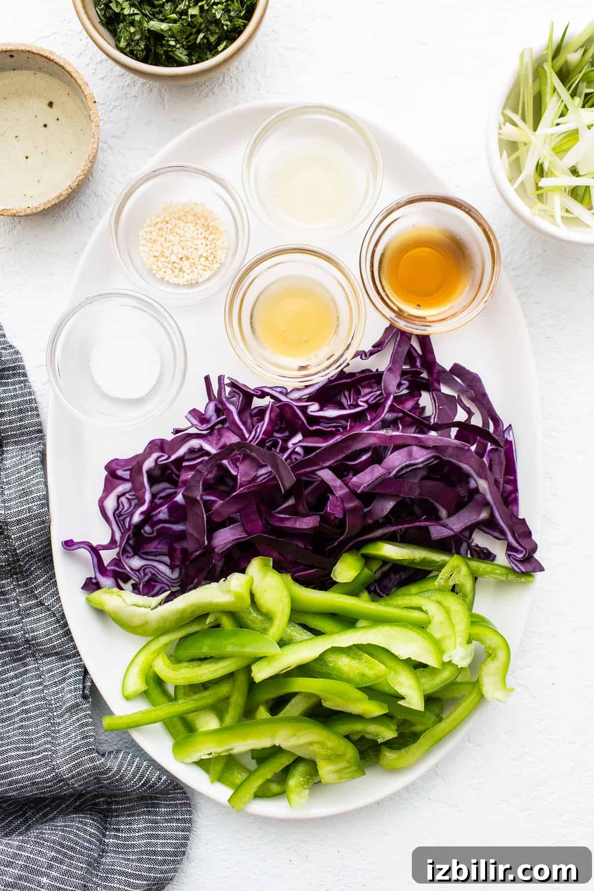 Spicy Gochujang Ground Chicken Bowl Recipe 3 Sliced vegetables on a plate.