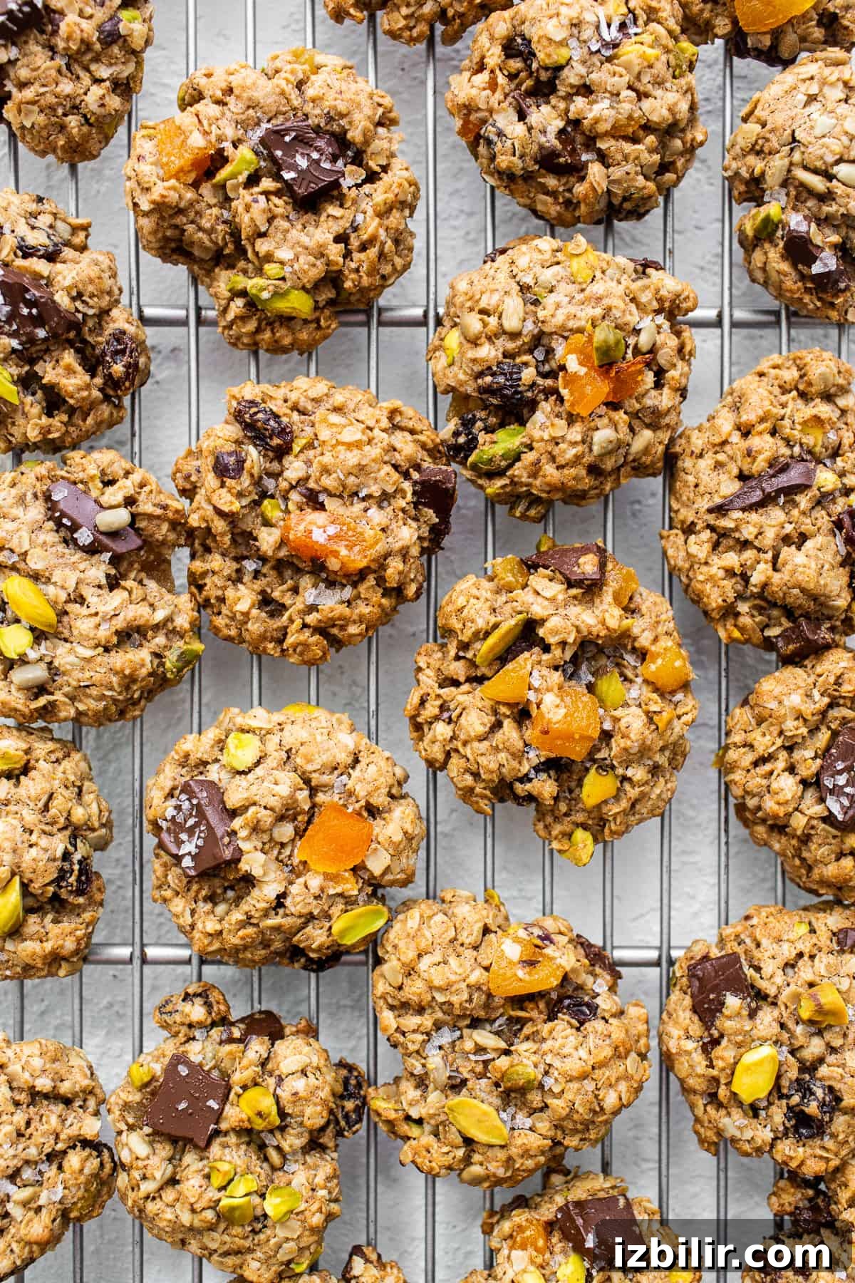 Trail mix cookies on a cooling rack.