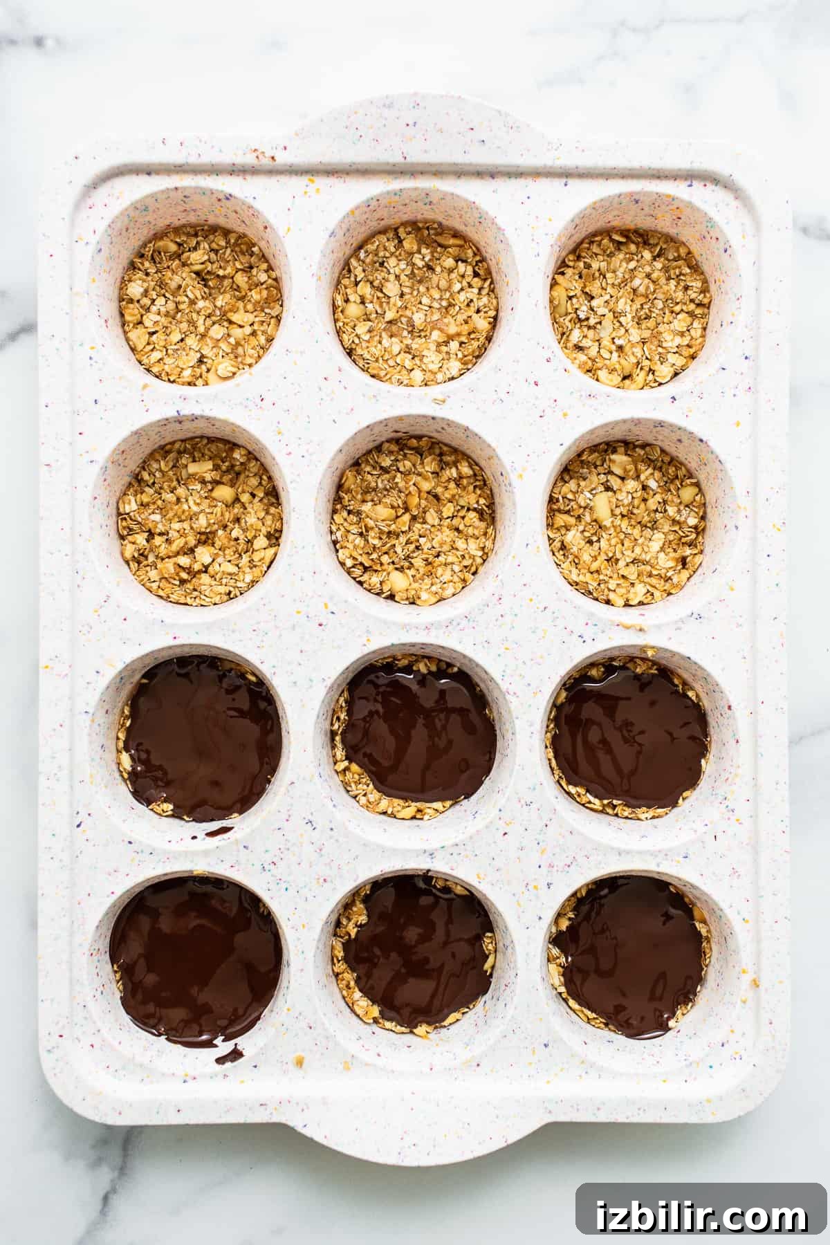 oat cups in a muffin tin.