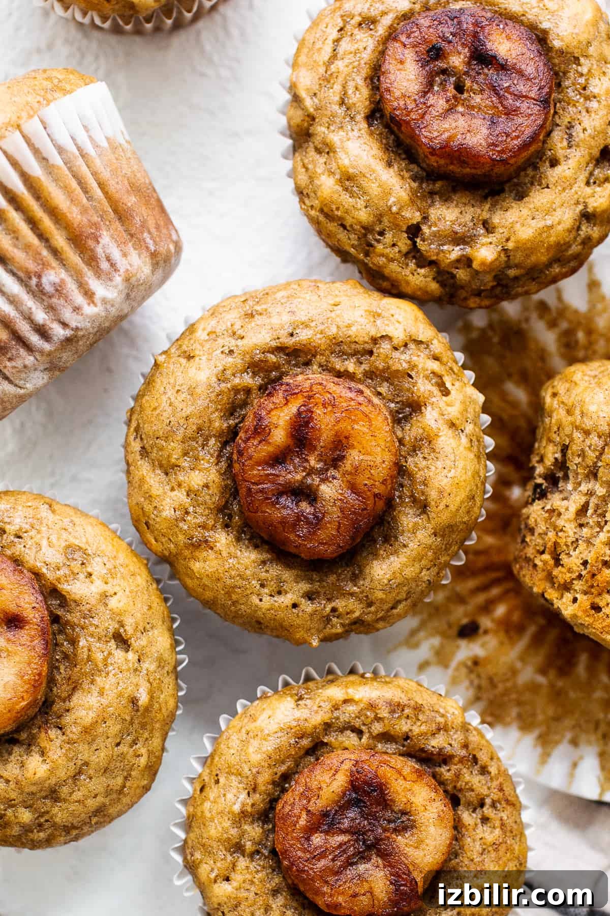 Bananas Foster Muffins are made with a delicious banana muffin base and sweet, caramelized bananas on top for the perfect snack. bananas foster muffin.