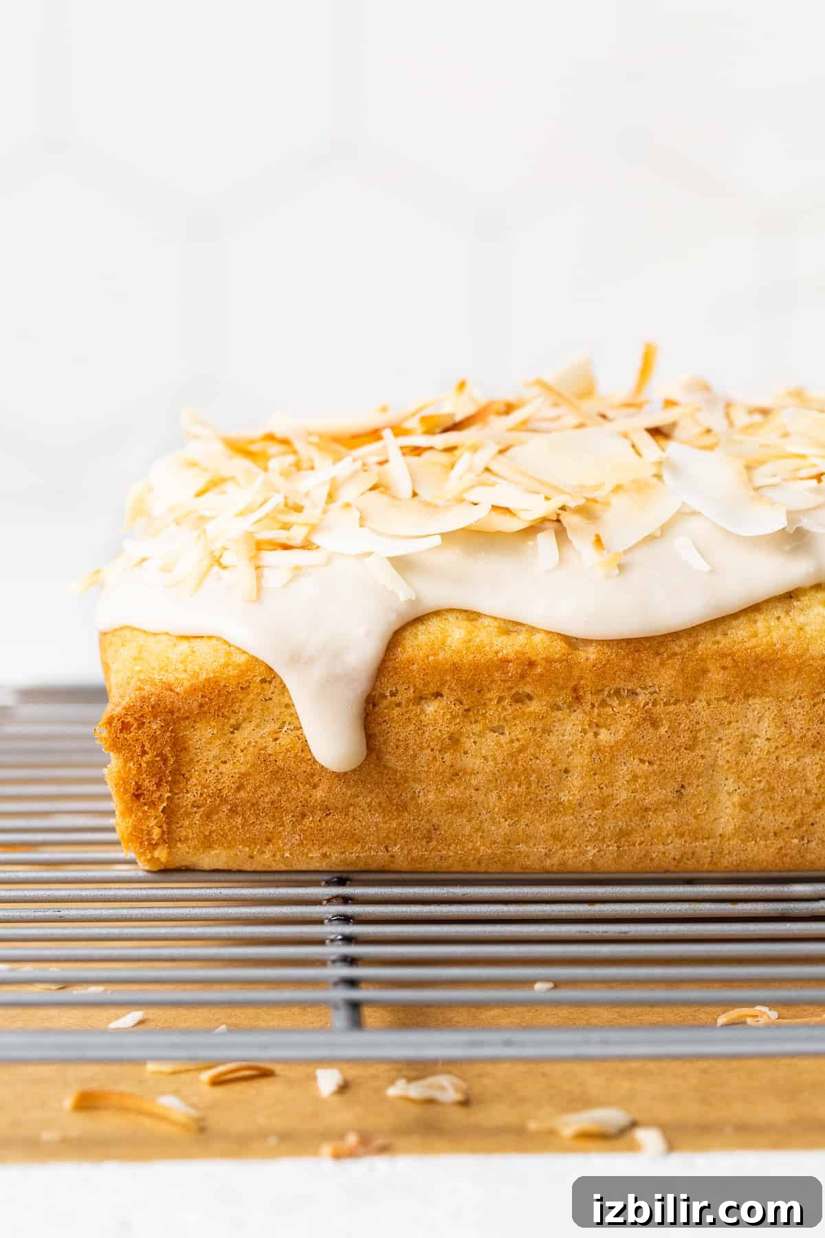 coconut cake on drying rack.