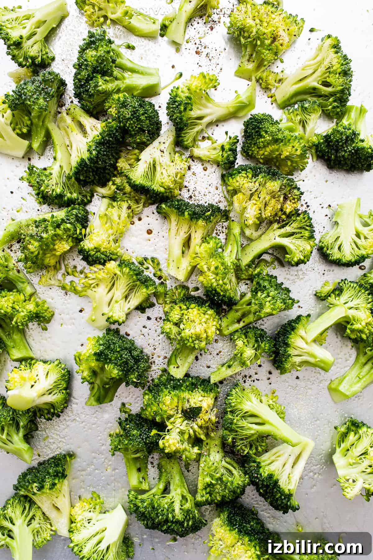 Roasted broccoli on a sheet pan.