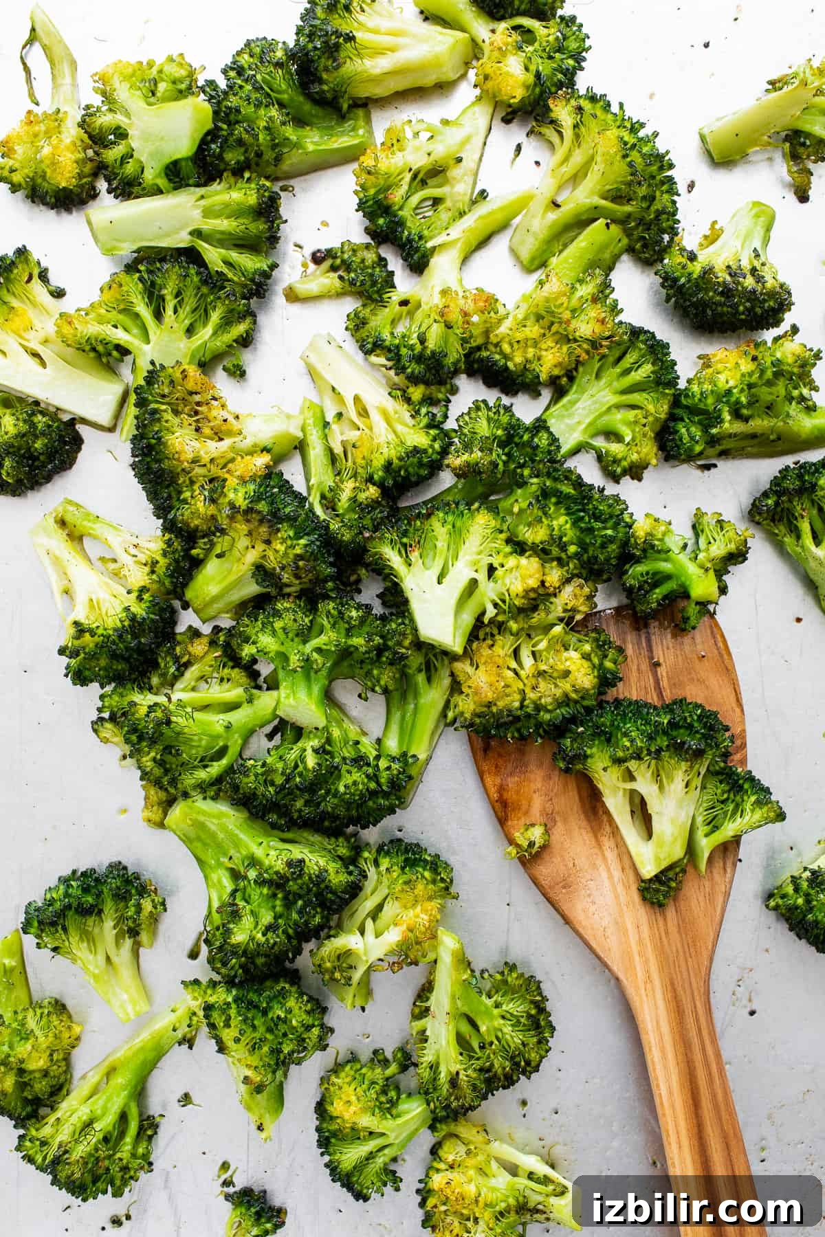 Roasted broccoli on a spatula.