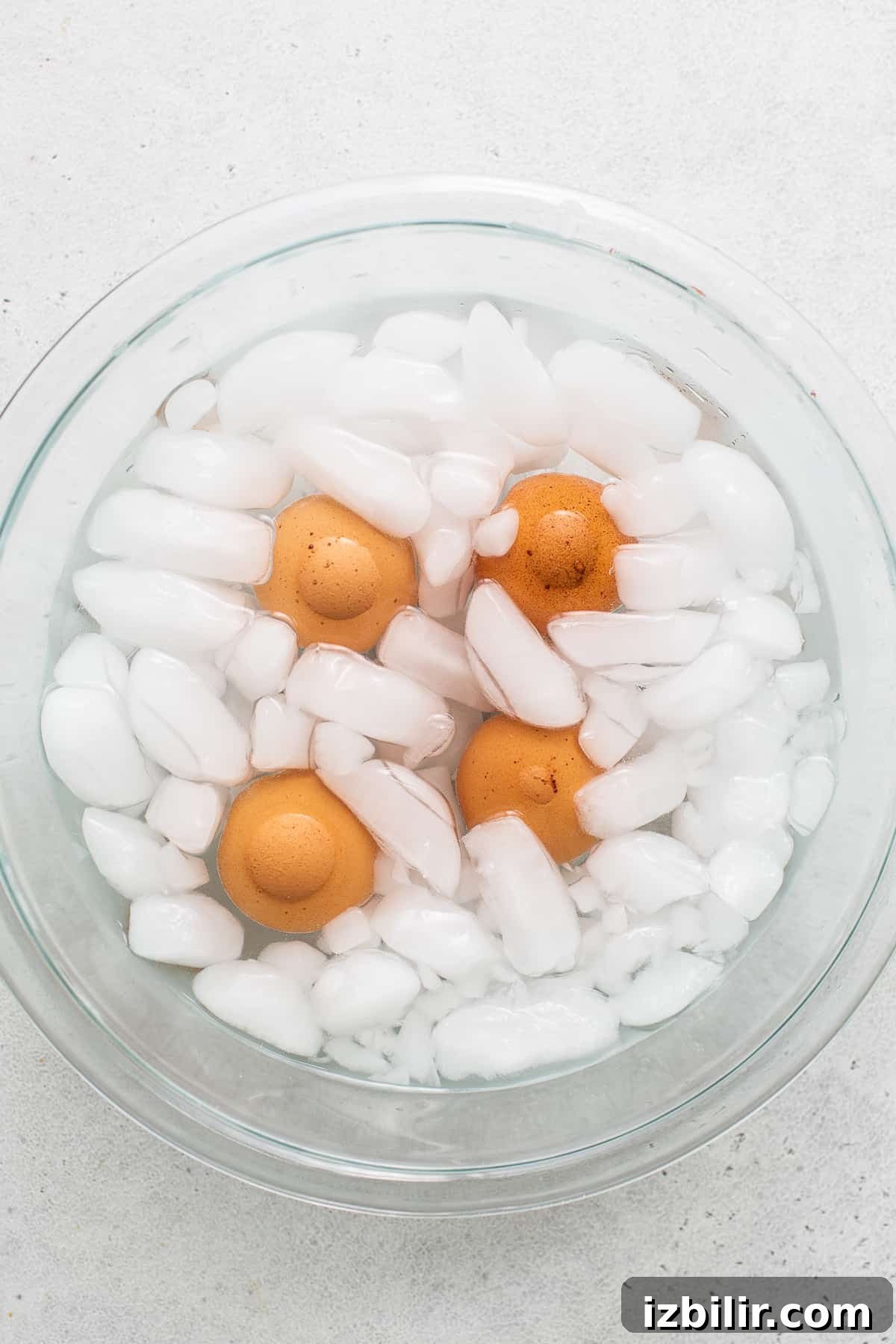 Hard boiled eggs in a bowl of ice water.