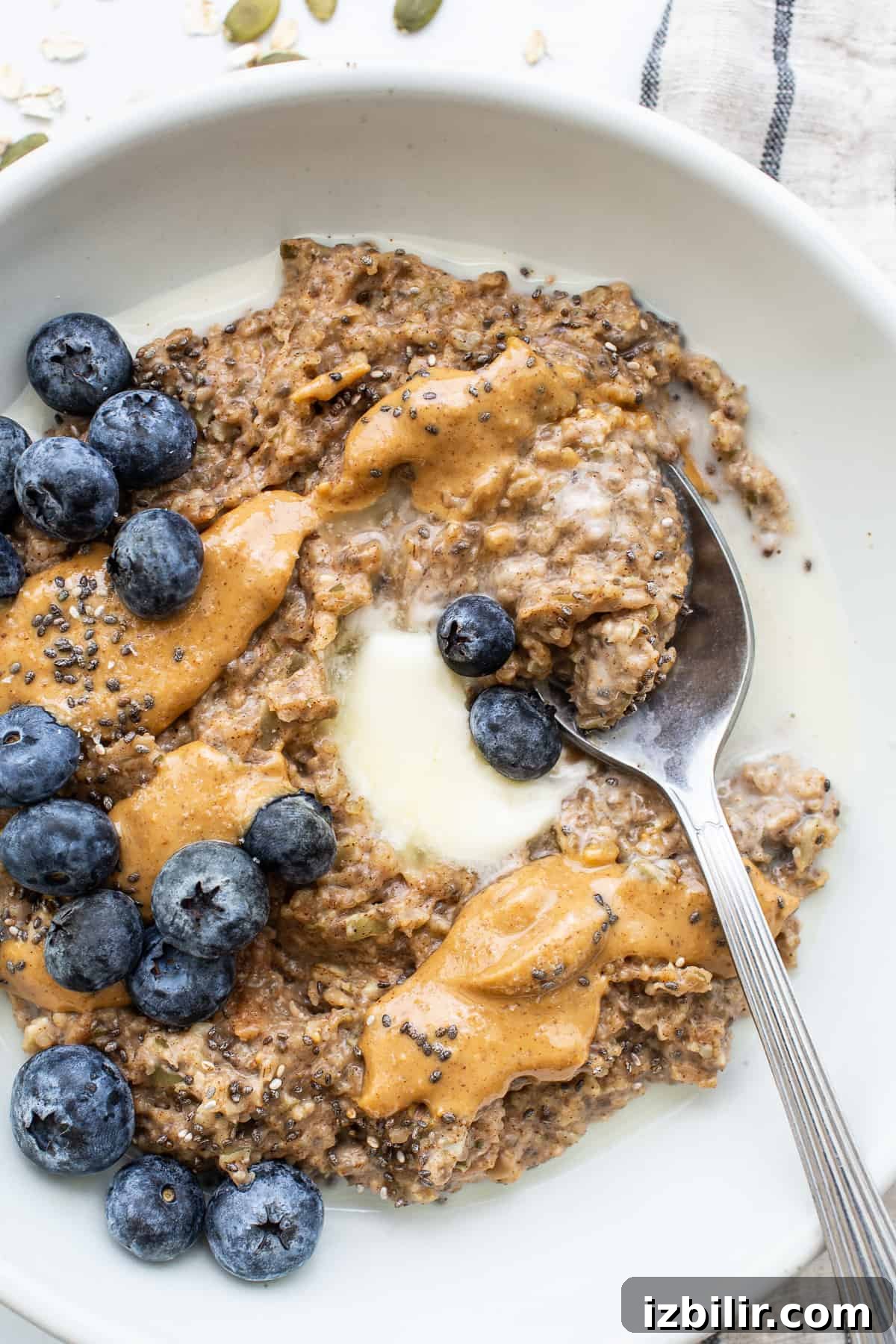 Porridge topped with nut butter and fruit.