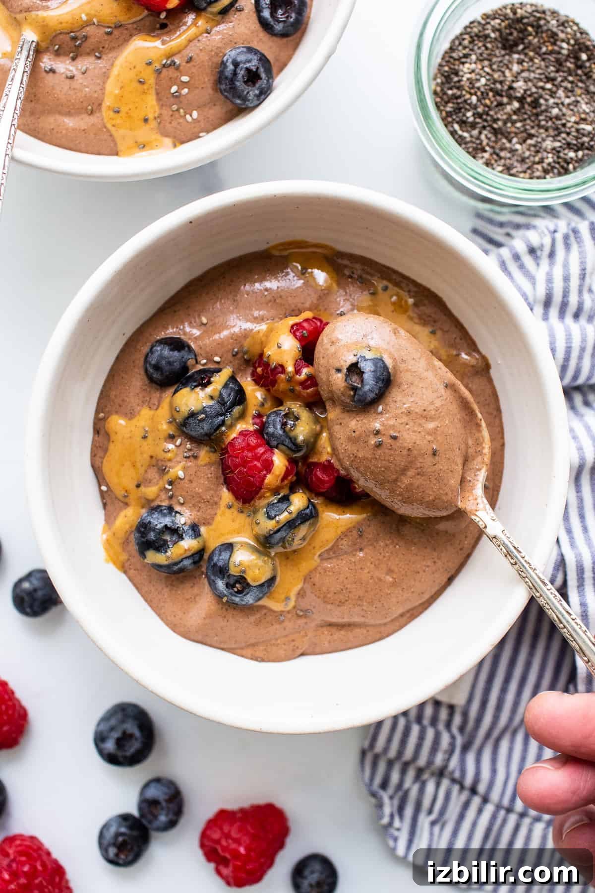 Blended chia seed pudding in a bowl with a spoon.