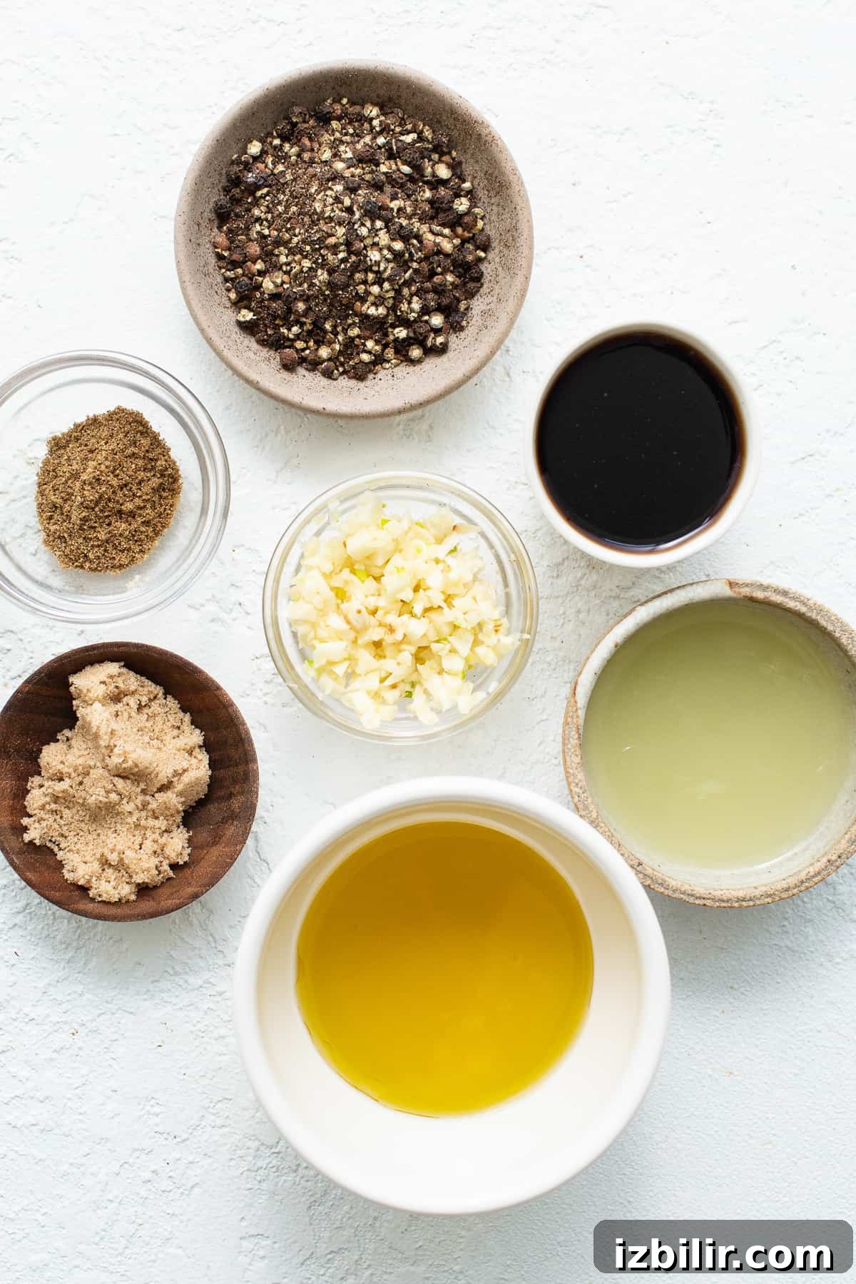 Ingredients for skirt steak marinade in small bowls.