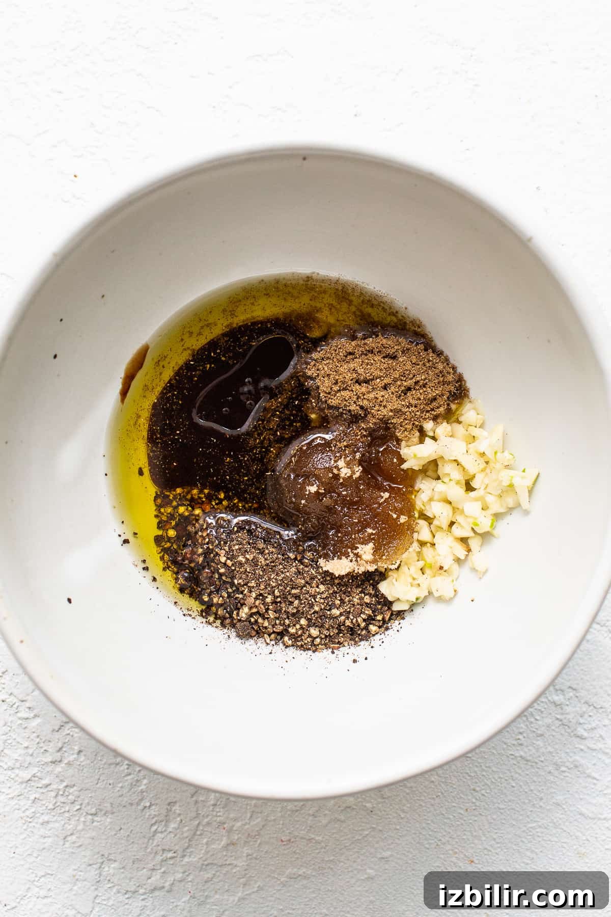 All of the ingredients for skirt steak marinade in a mixing bowl.