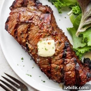 grilled steak on plate with butter