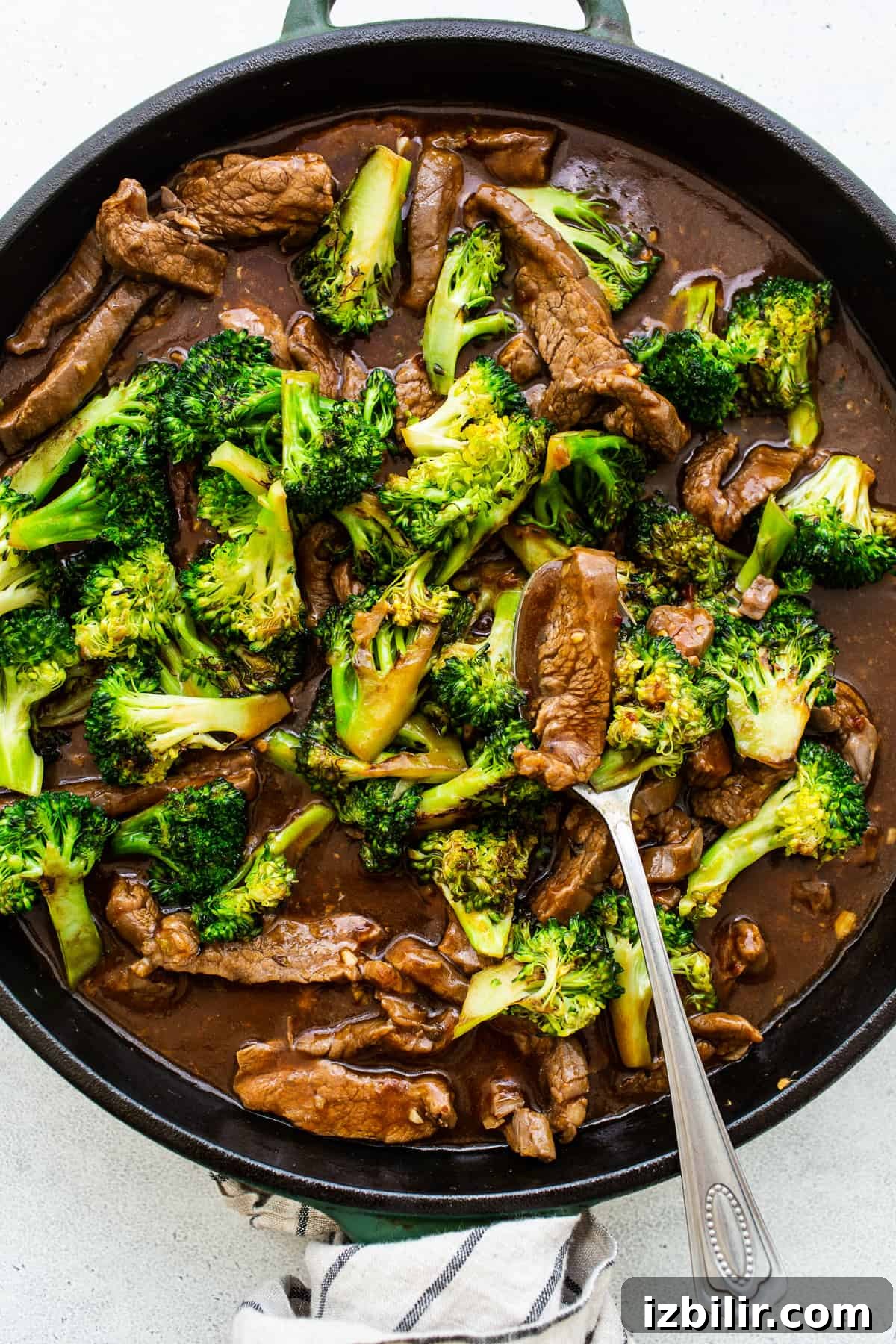 beef and broccoli in pan.