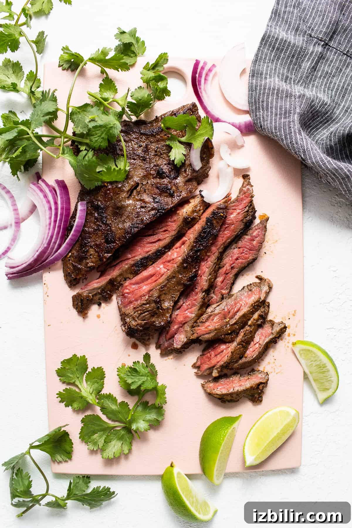 Sliced skirt steak ready to serve Sliced skirt steak on a cutting board.